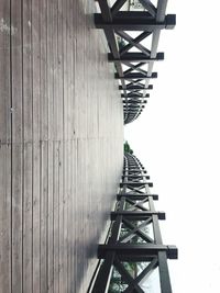 Low angle view of pier against clear sky