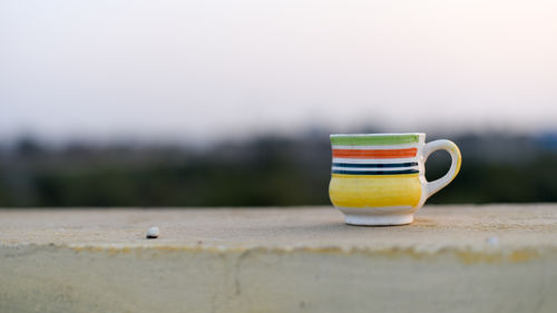 Close-up of coffee cup on table