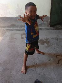 Full length of cute girl standing on floor