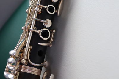 Close-up of machine part against wall