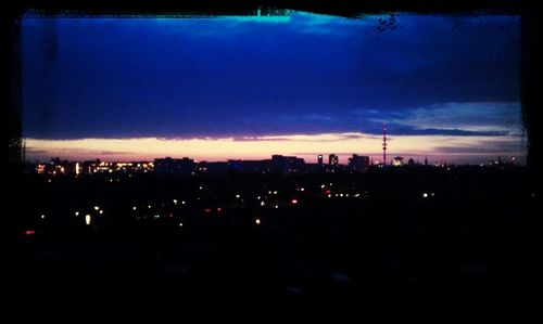 Illuminated cityscape at night