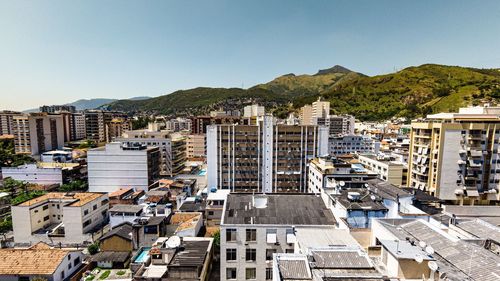 High angle view of buildings in city against sky