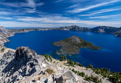 Panoramic view of sea and rocks against sky