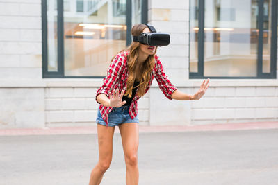 Full length of woman standing in city