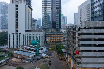 Modern buildings in city against sky