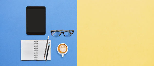 Directly above shot of eyeglasses on book
