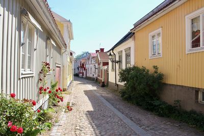 Street amidst buildings against sky