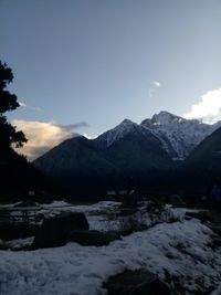 Scenic view of snowcapped mountains against sky