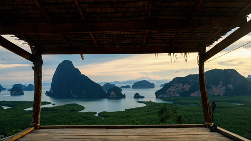 Wooden cabin on top of hill to see view of limestone karsts and adaman sea in phang nga bay.