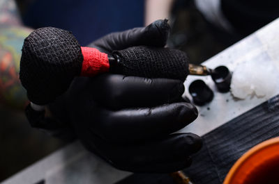 Cropped image of man holding dumbbell