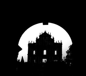 Low angle view of silhouette church against sky