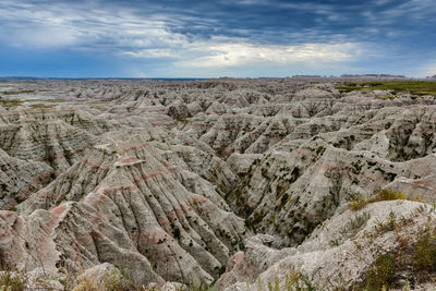 Scenic view of mountains against cloudy sky