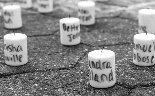 Close-up of text on sand