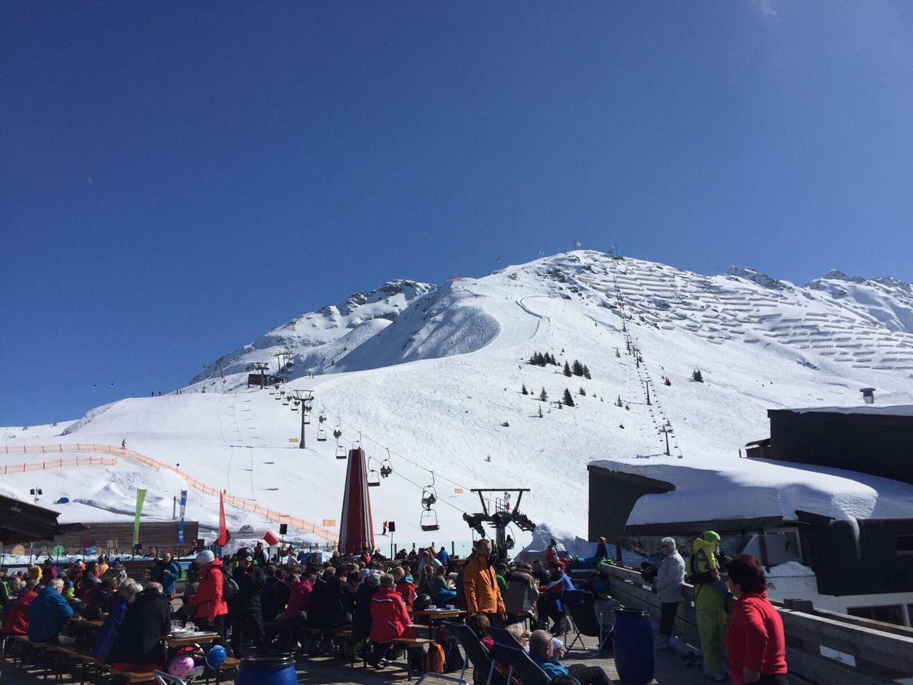 snow, winter, cold temperature, mountain, clear sky, season, large group of people, blue, snowcapped mountain, copy space, mountain range, transportation, weather, white color, leisure activity, landscape, travel, skiing, lifestyles