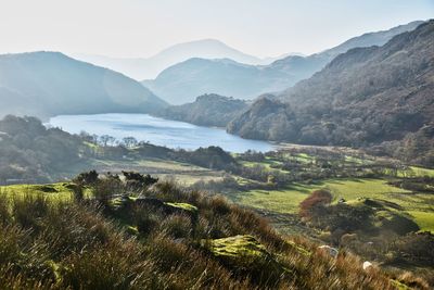 Scenic view of landscape and mountains against sky