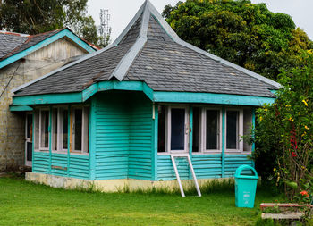 Exterior of house and trees on field