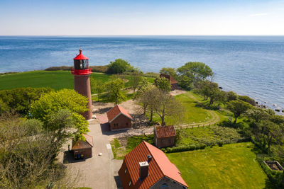 Scenic view of sea and buildings against sky