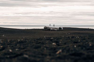 Airplane on runway against sky