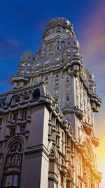 Low angle view of historical building against blue sky