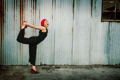 Woman standing on wooden floor