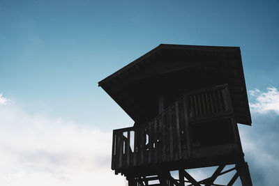 Low angle view of old tower against sky