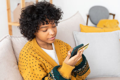 Young woman using mobile phone