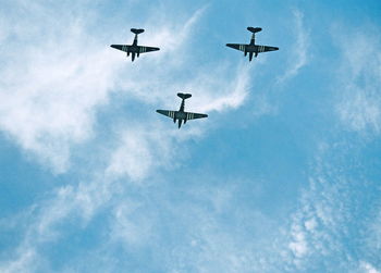 Low angle view of airplane flying in sky