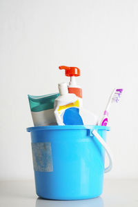 Close-up of plastic bottle against white background