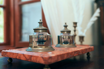 Close-up of metallic bell on table