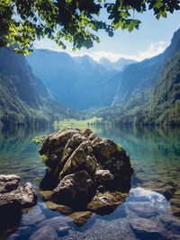 Scenic view of lake and mountains against sky