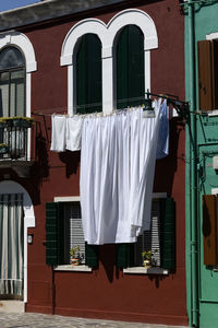 Clothes drying against buildings in burano