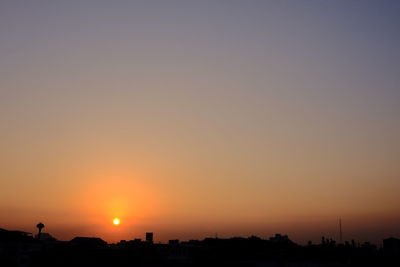 Scenic view of silhouette landscape against clear sky during sunset