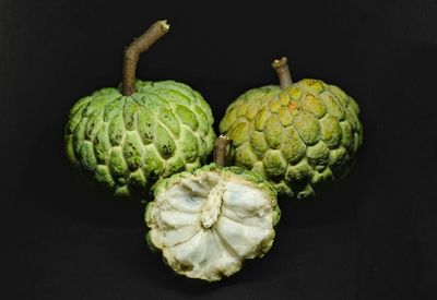 Close-up of fruits against black background