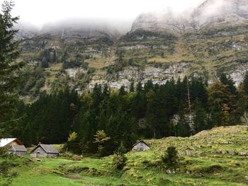 Scenic view of mountains in foggy weather