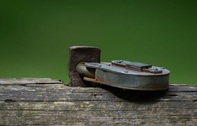 Close-up of lock on wooden fence