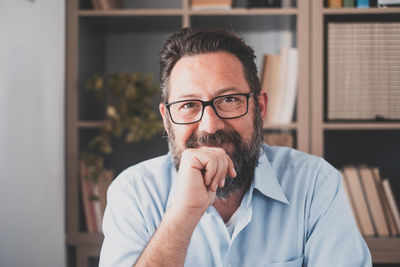 Portrait of man wearing eyeglasses