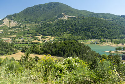 Scenic view of landscape and mountains against sky