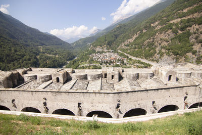 Built structure on mountain against sky