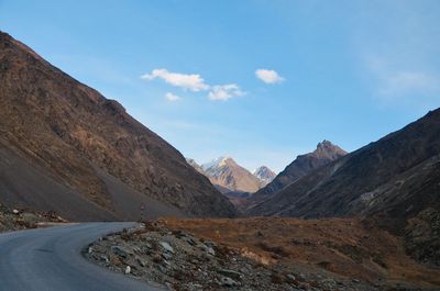 View of mountain road against cloudy sky