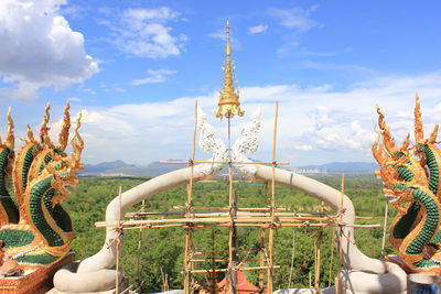 View of sculpture against cloudy sky