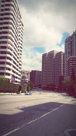 City street against cloudy sky