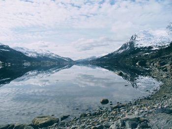 Scenic view of snowcapped mountains against sky