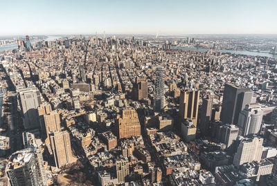 High angle view of modern buildings in city against sky