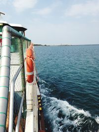 Ferry boat on sea against sky