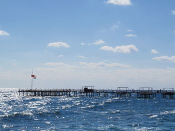 Pier over sea against sky