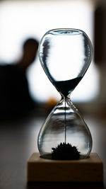 Close-up of hourglass on table