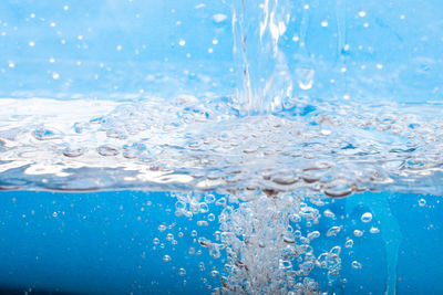 Close-up of water splashing in swimming pool