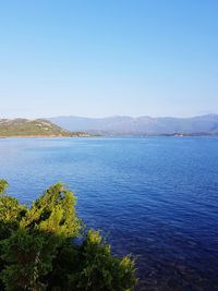 Scenic view of sea against clear blue sky