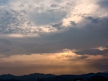 Low angle view of cloudy sky during sunset