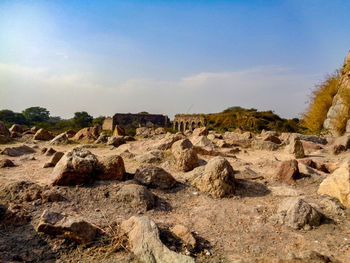 Rock formations on landscape against sky